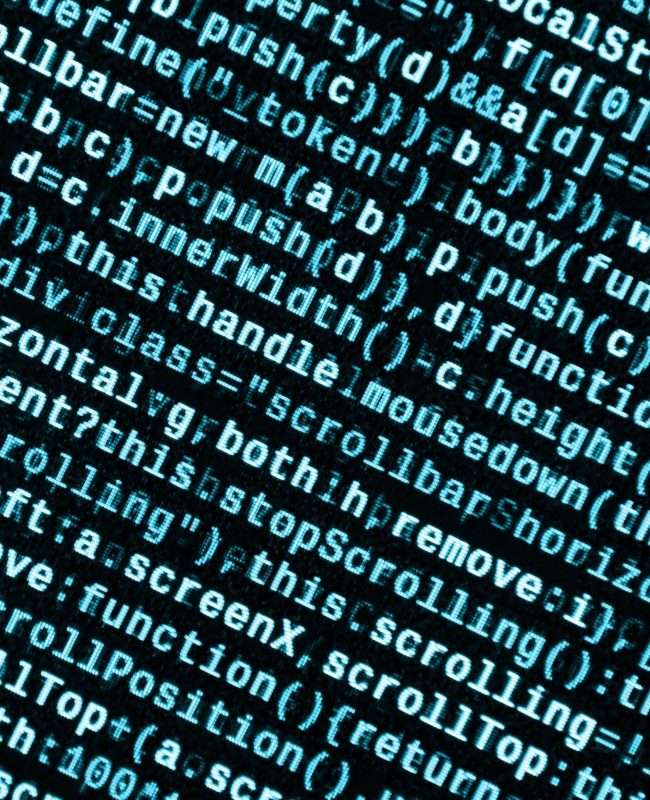 Big data and Internet of things trend. IT specialist workplace. Website HTML Code on the Laptop Display Closeup Photo. Big data storage and cloud computing representation